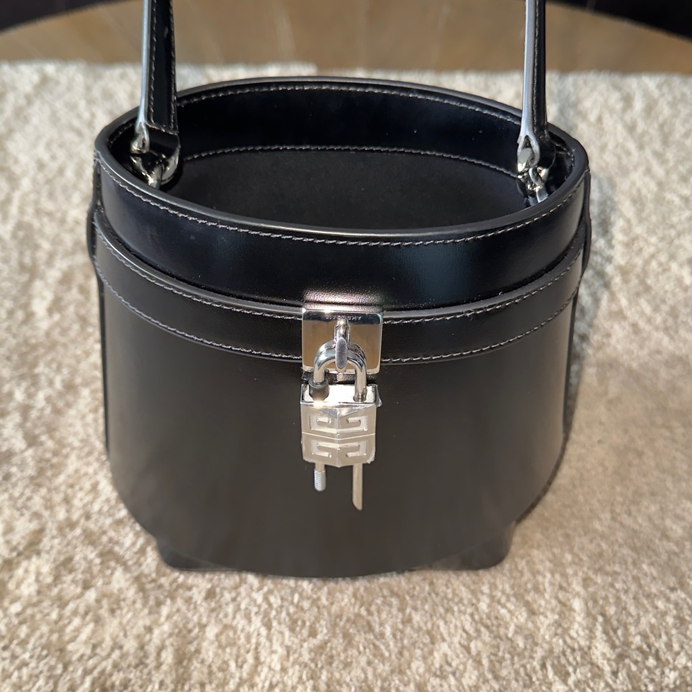 Givenchy Bag in excellent condition. This bag still has plastic over hardware.